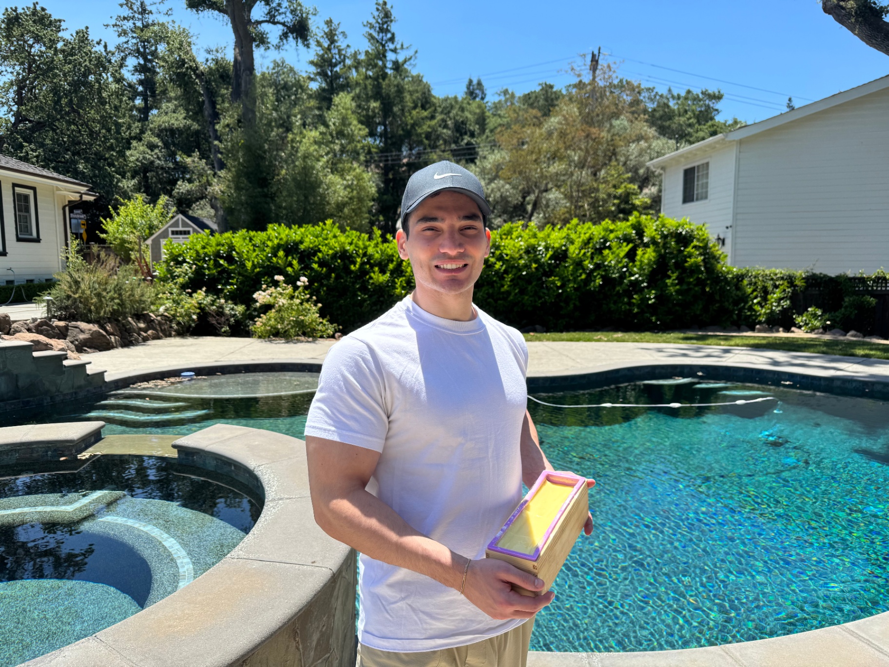 Zach, founder of Zach's Naturals, holding a fresh batch of handmade tallow soap